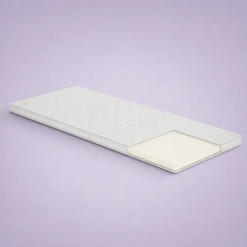 Materac nawierzchniowy Visco 3D Gral – cienki materac z przekrojem jasnej pianki w narożniku na fioletowym tle